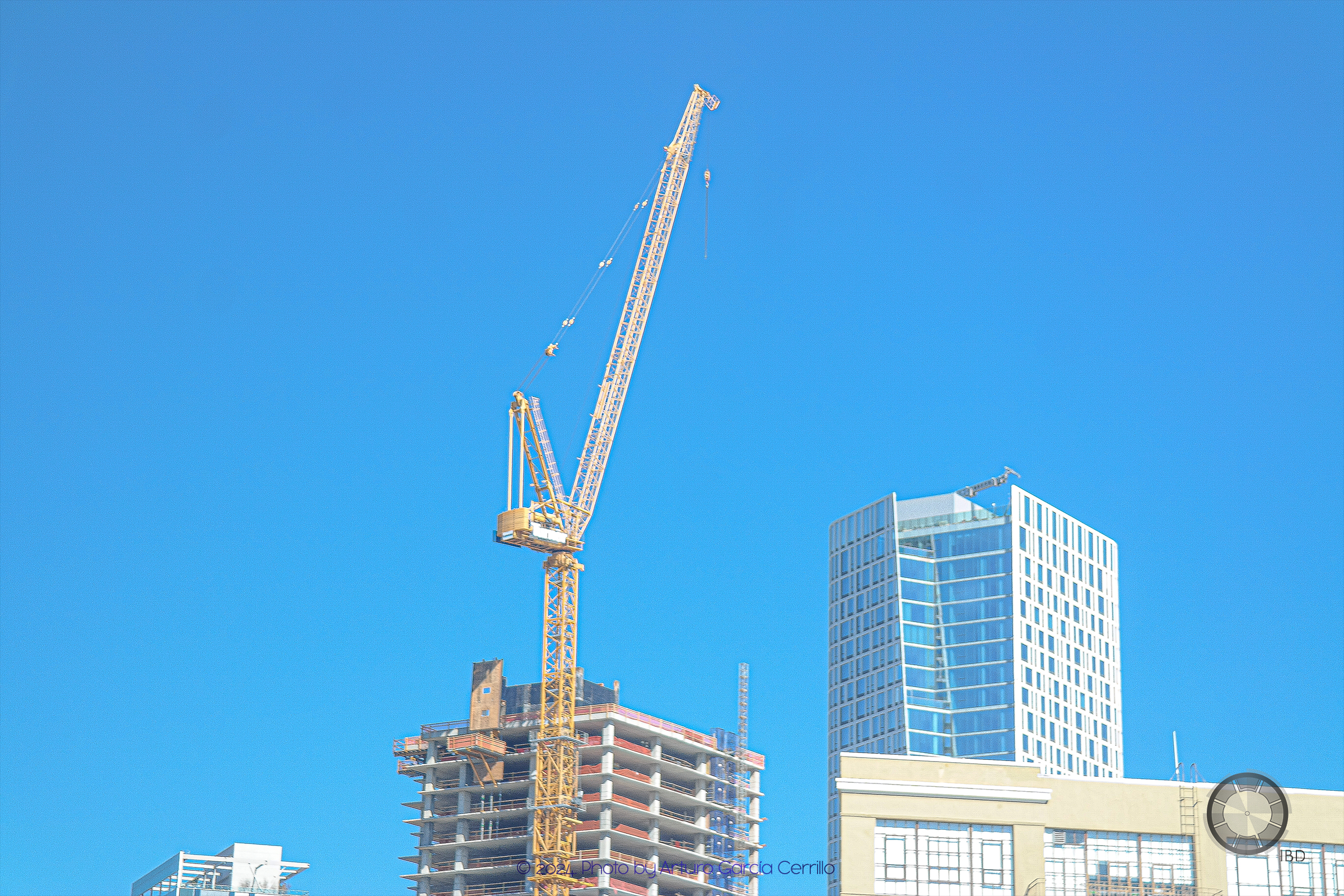 Picture of tower crane with blue sky background