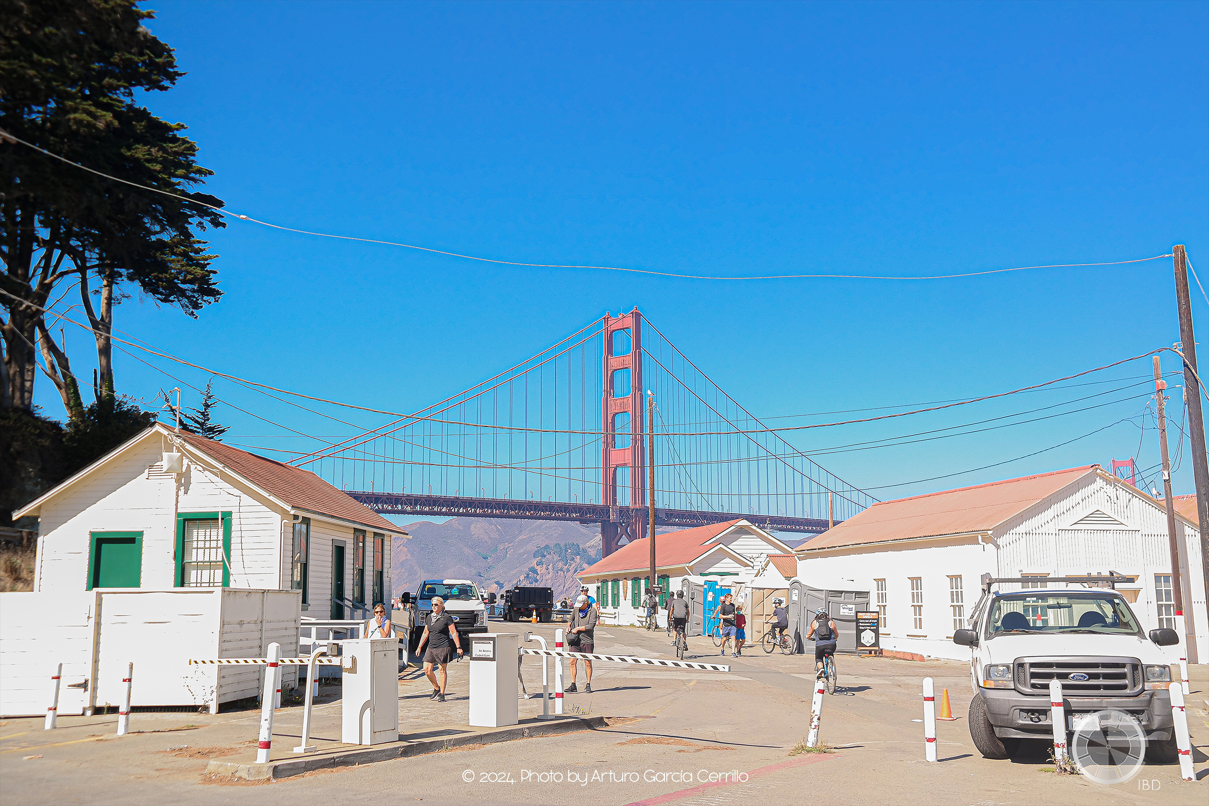 Picture of white buildings and Golden Gate bridge in the background