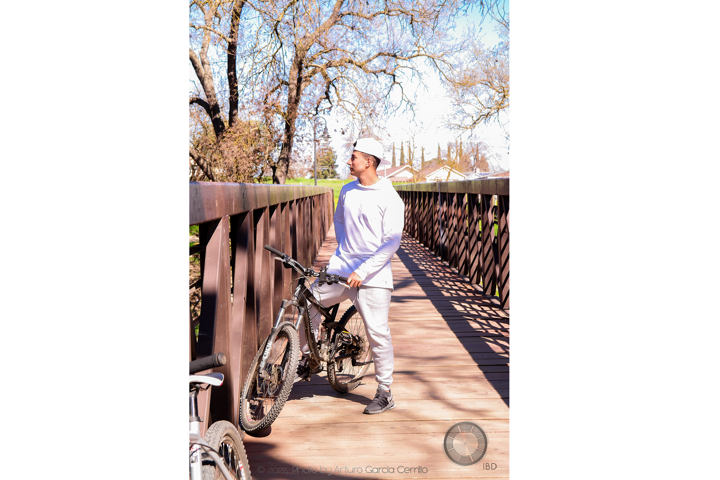 Picture of guy on bycicle looking away to the side.