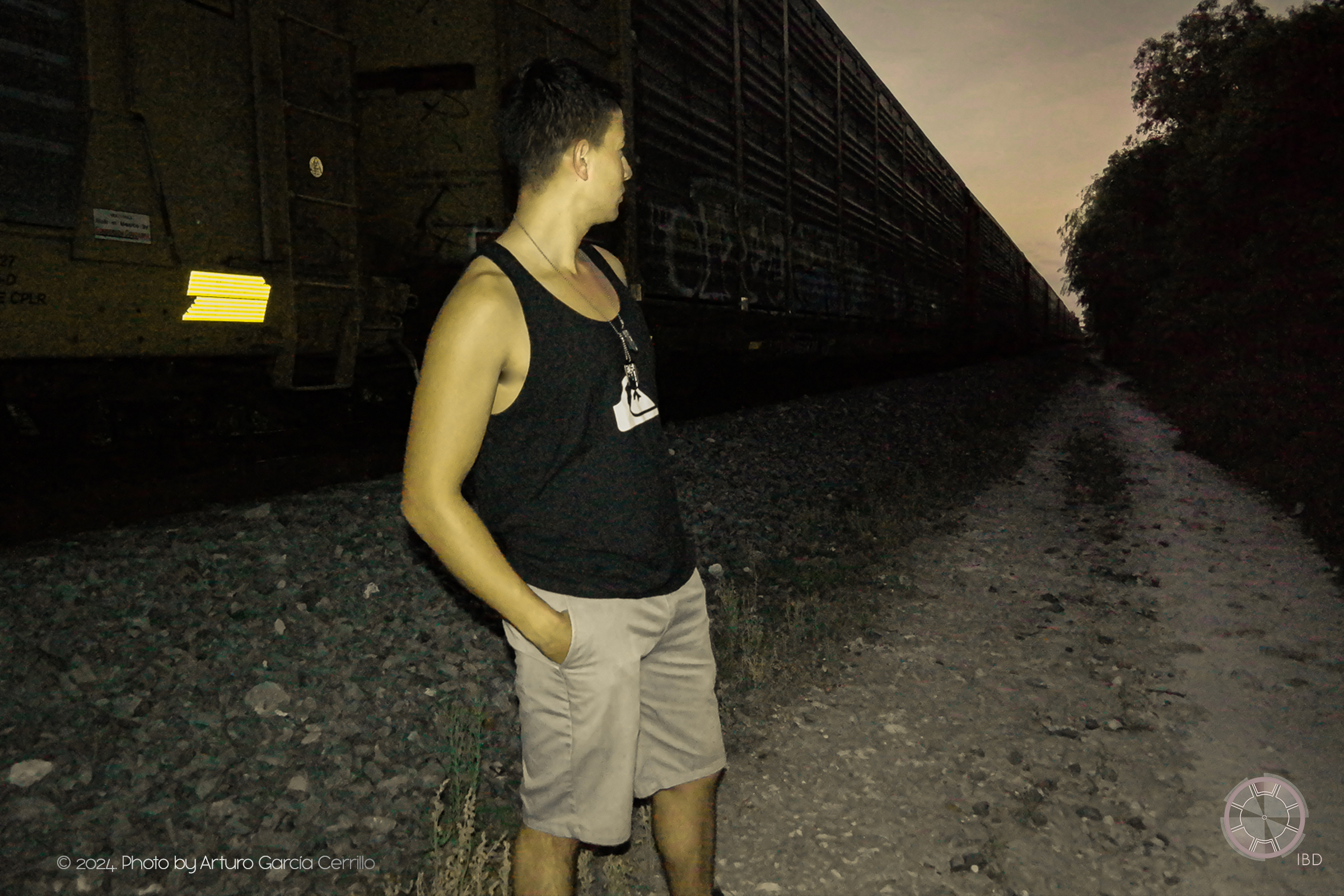 Portrait of guy standing next to moving train