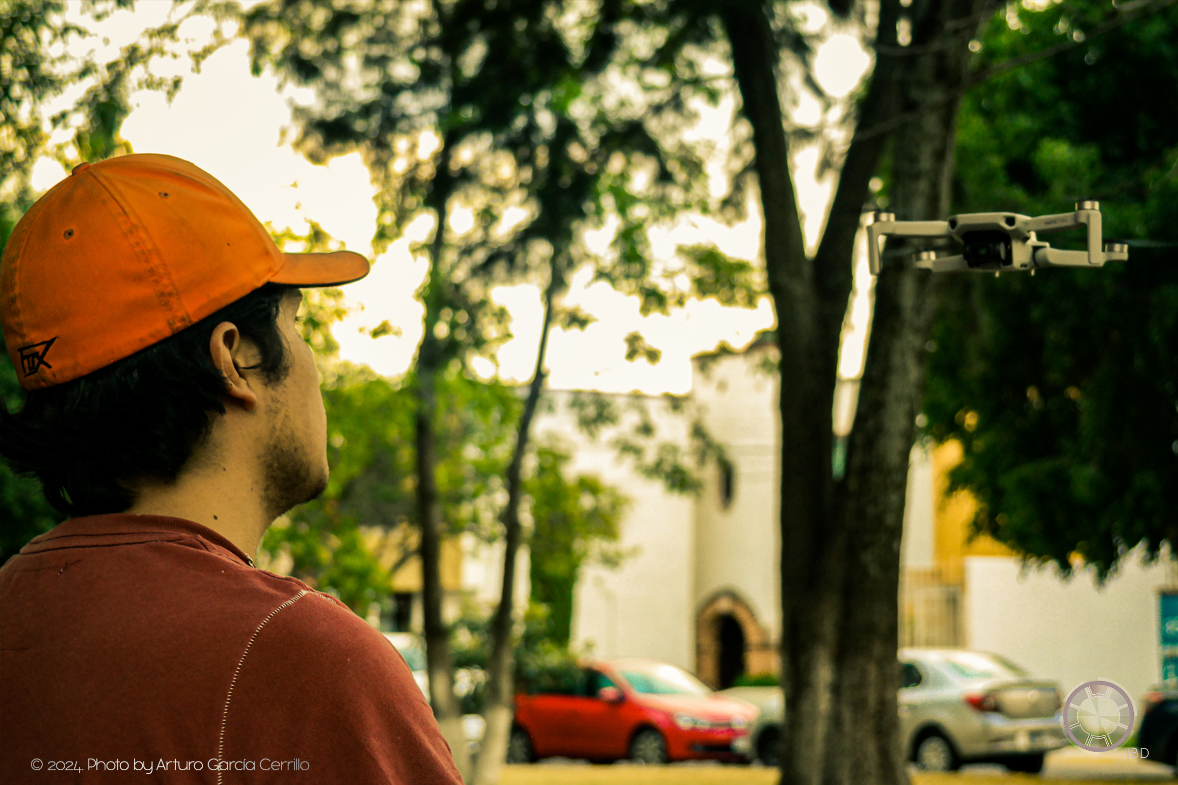 Portrait of guy observing a drone in front of him