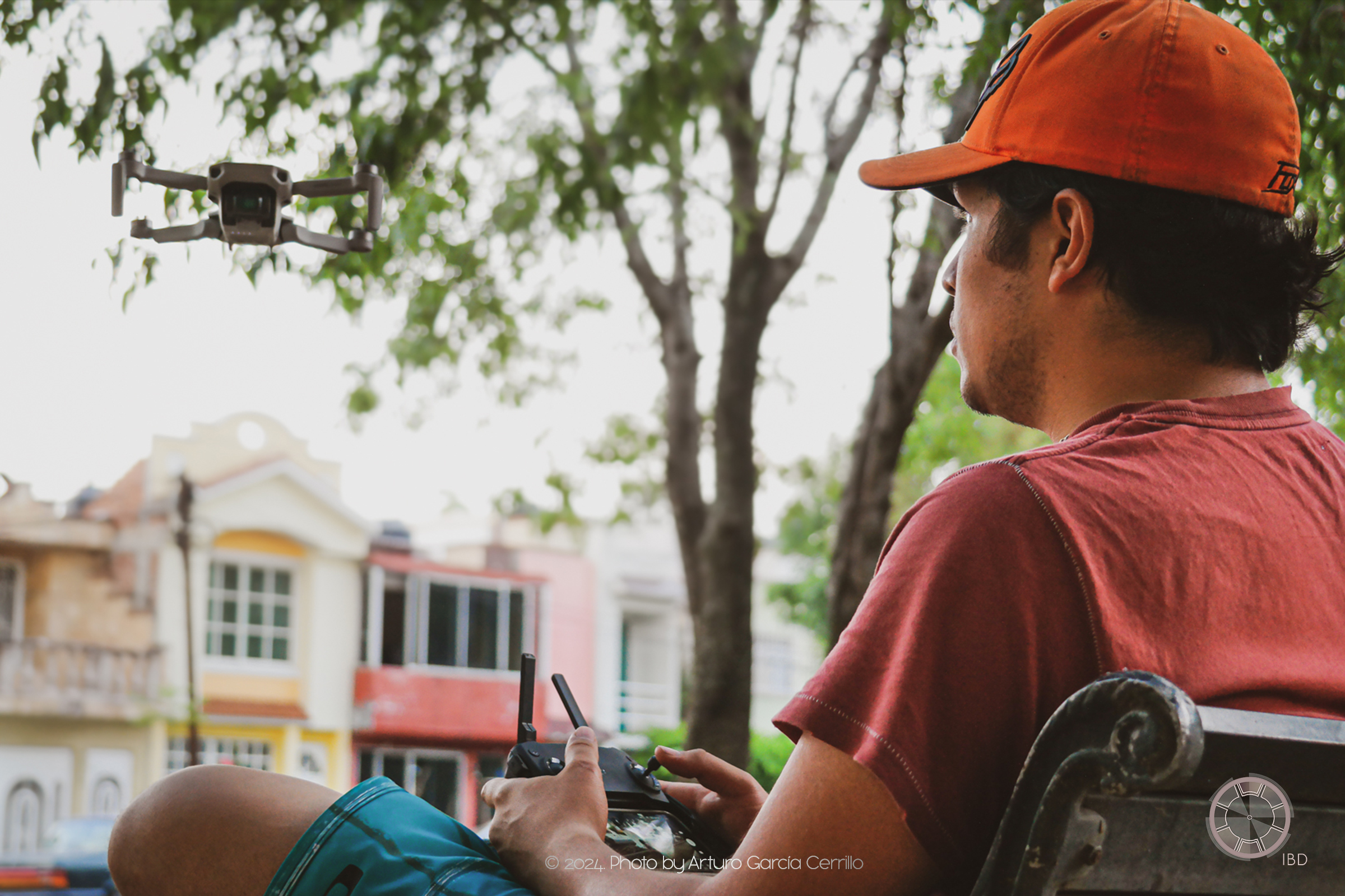 Portrait of guy flying a drone