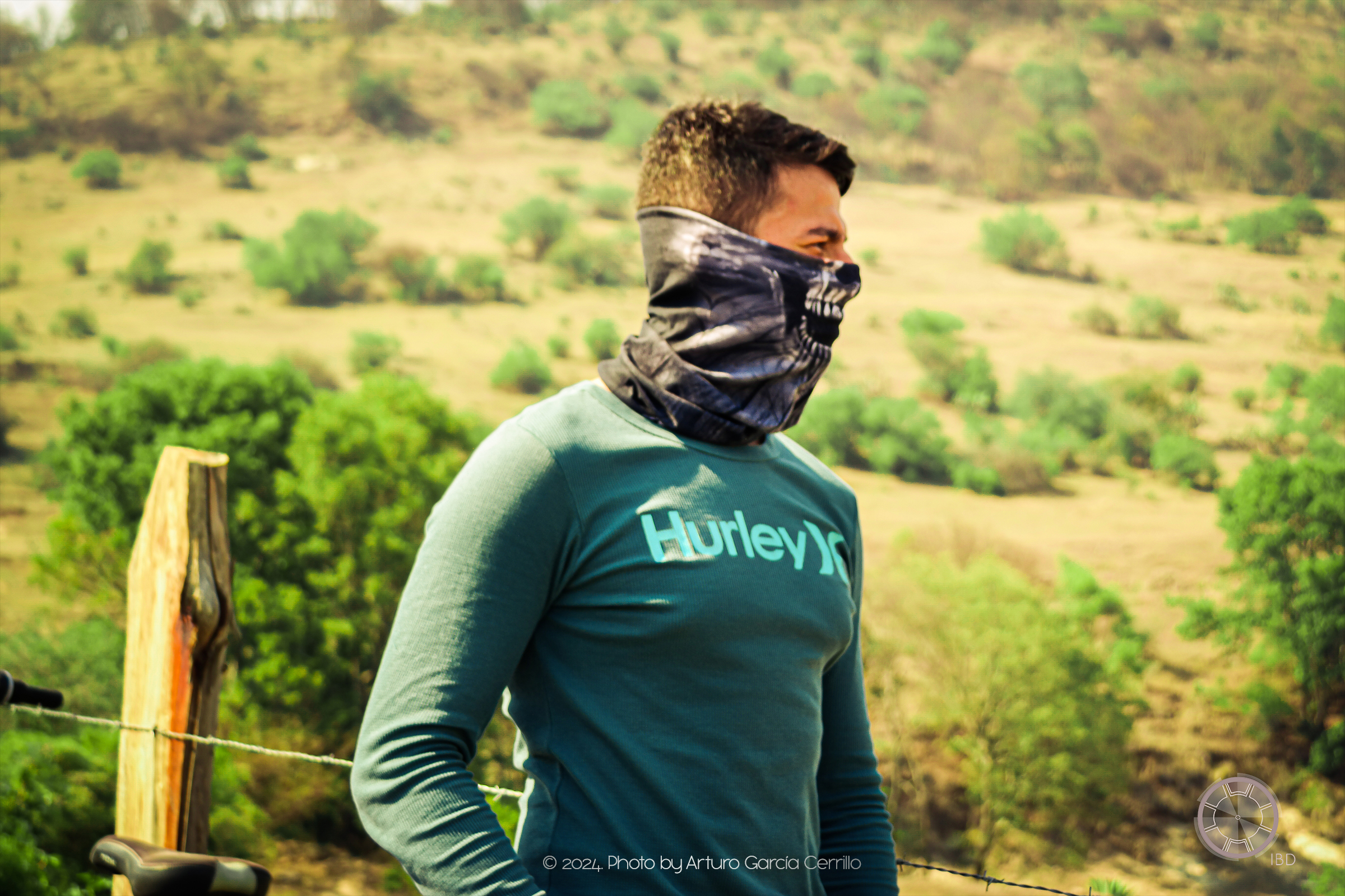 Portrait of side profile of guy at green landscap