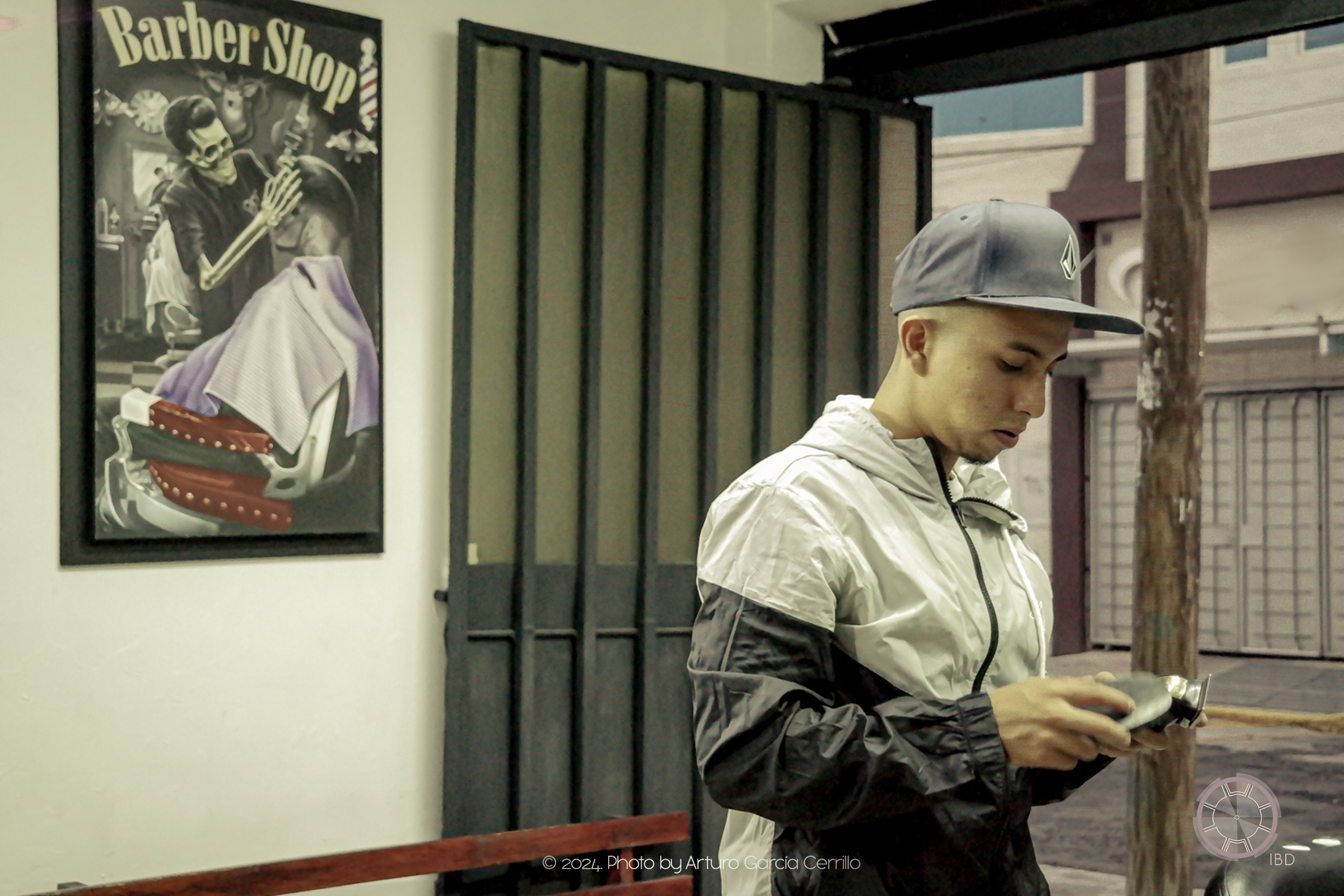 Portrait of guy setting up his hair clipper