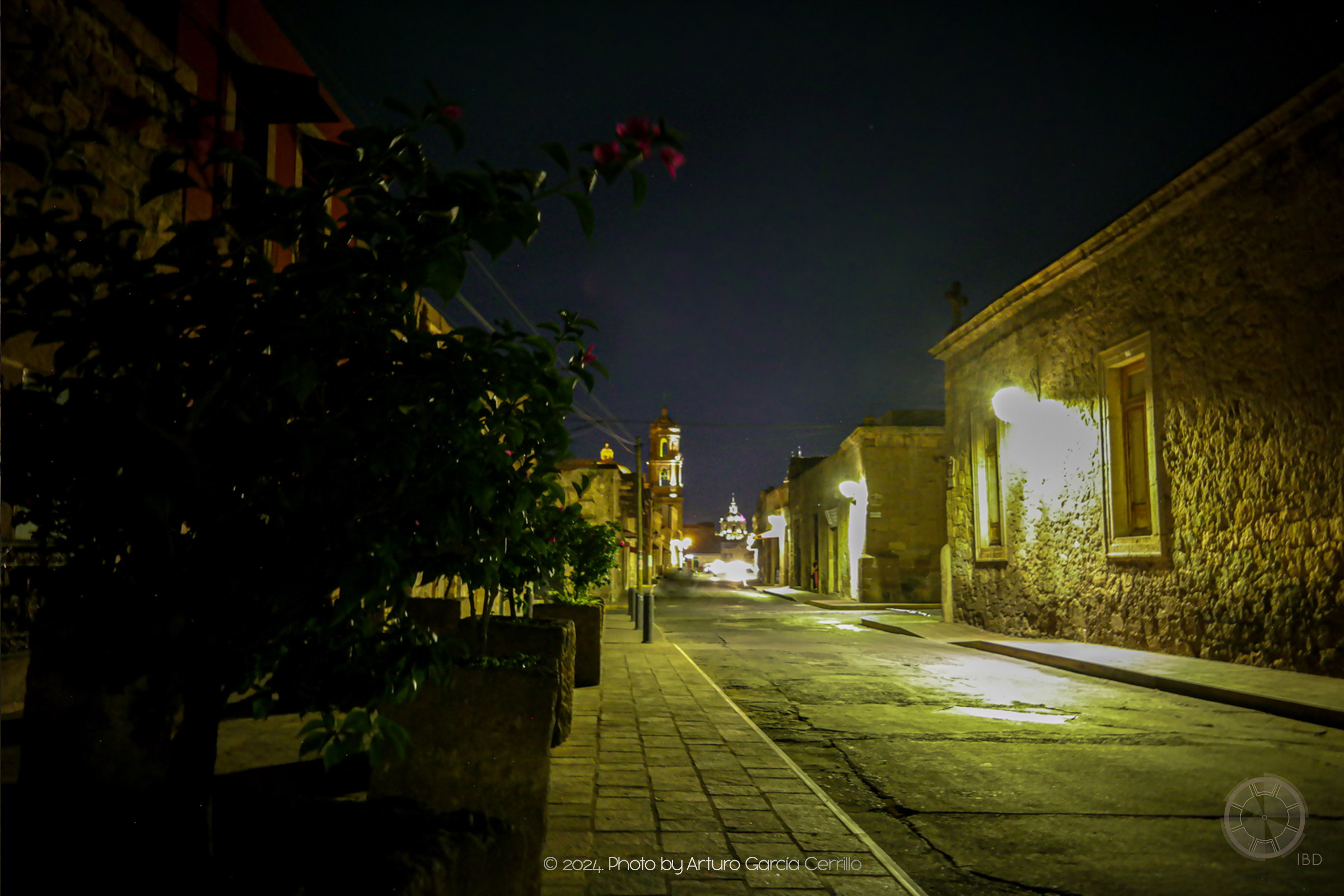 Picture at night of one of Morelia's downtown streets showing stone-made buildings