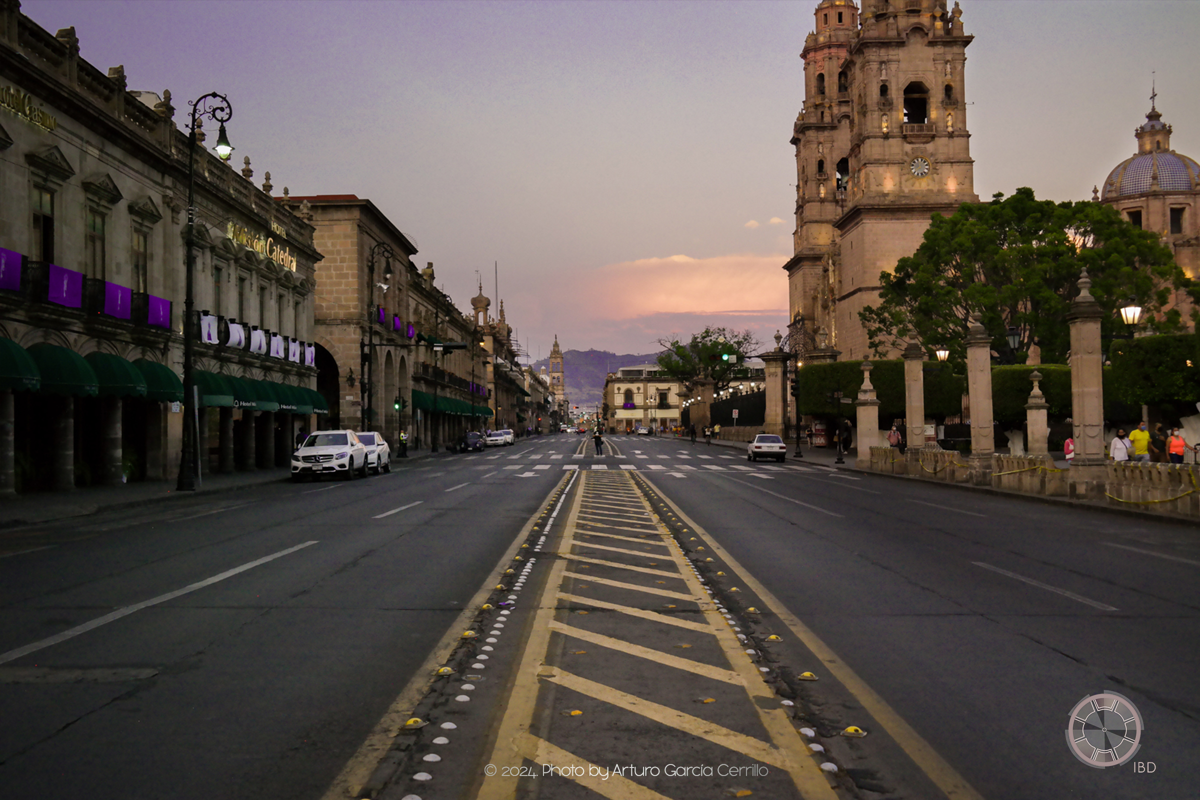 Picture of main Morelia's downtown avenue. Taken at dusk showing part of the Cathedral.