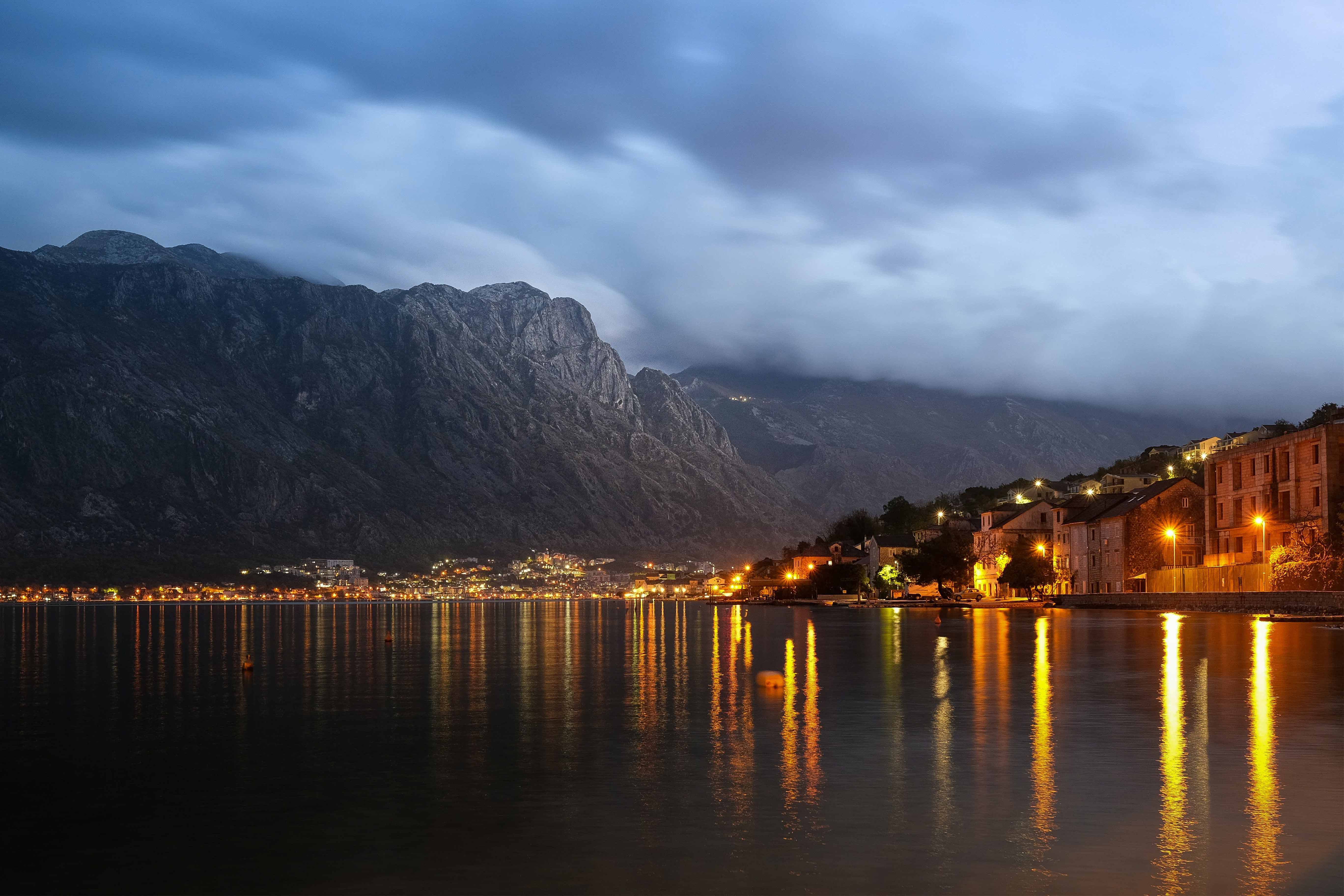 Picture of night landscape with lake and town