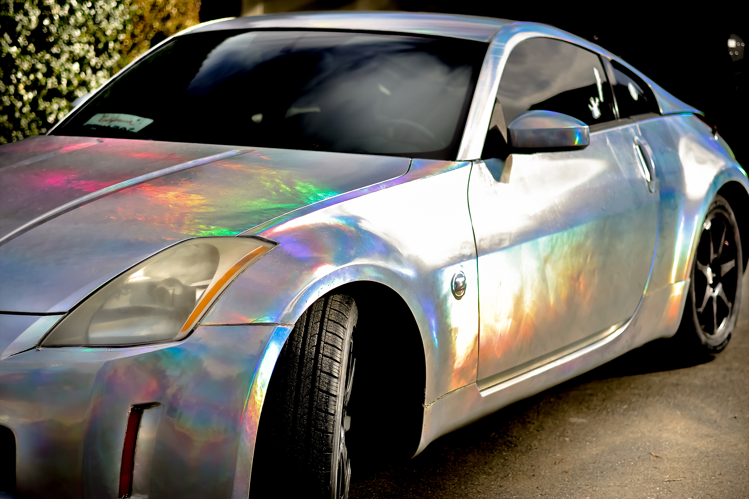 Close-up Picture of Arturo's nissan 350z with holographic wrap job